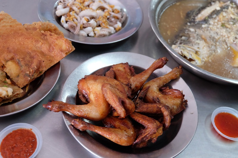 (Clockwise from left) prawn fritters,  boiled octopus, Teochew style steamed fish and deep-fried spring chicken at Ong Cheng Huat.
