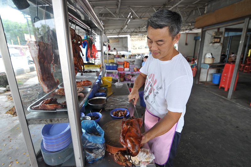 Fong Meng Jun says he roasts the ducks himself in order to get the delicious brown crispy skin.