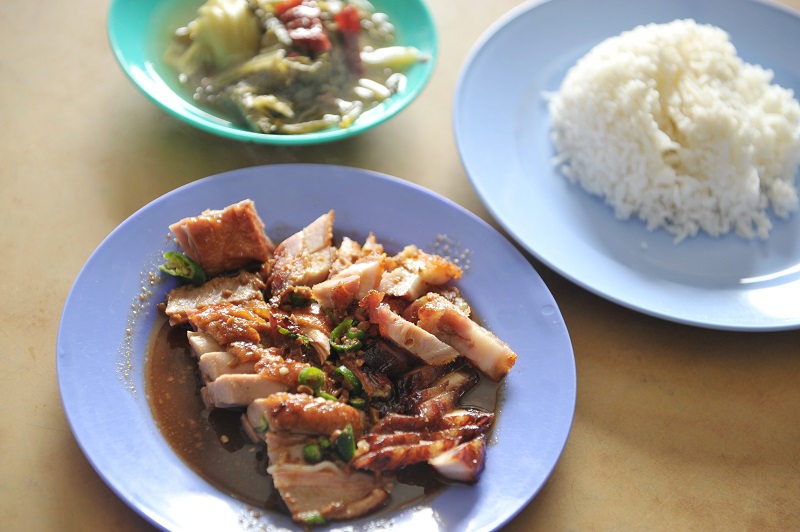 The roasted duck, rich in its special spicy sauce along Jalan Raja Uda.