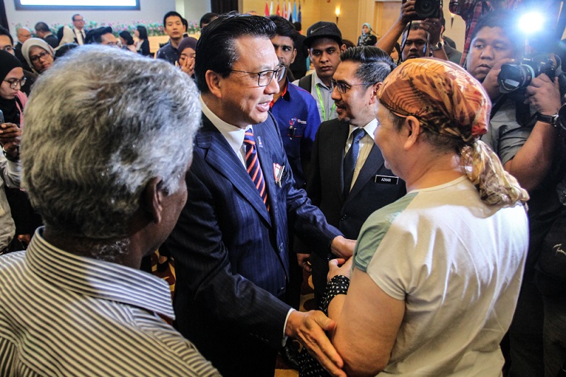 Transport Minister Datuk Seri Liow Tong Lai speaks to one of the victimu00e2u20acu2122s next of kin after the press conference in Kuala Lumpur January 10, 2018. u00e2u20acu201d  Picture by Shafwan Zaidon 