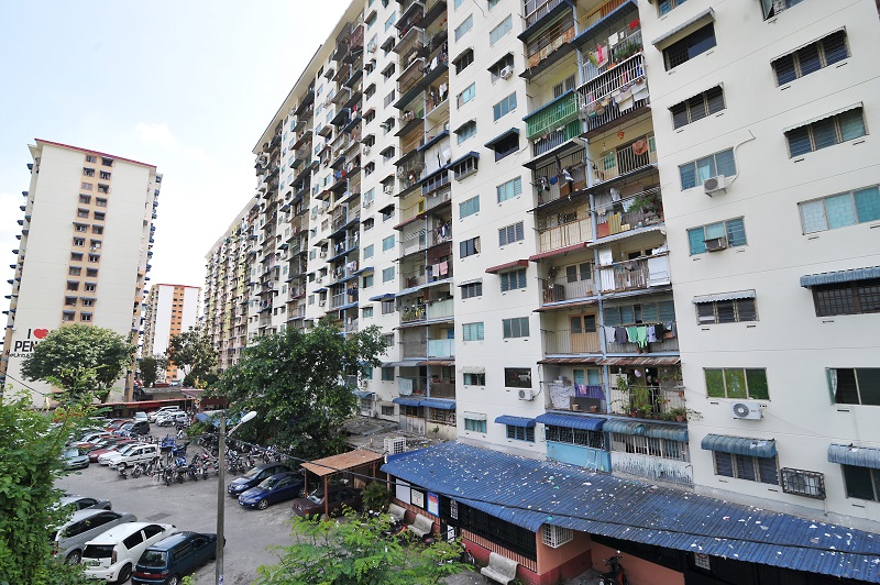 Litter strewn all over the awning below the low cost flats in Rifle Range. 