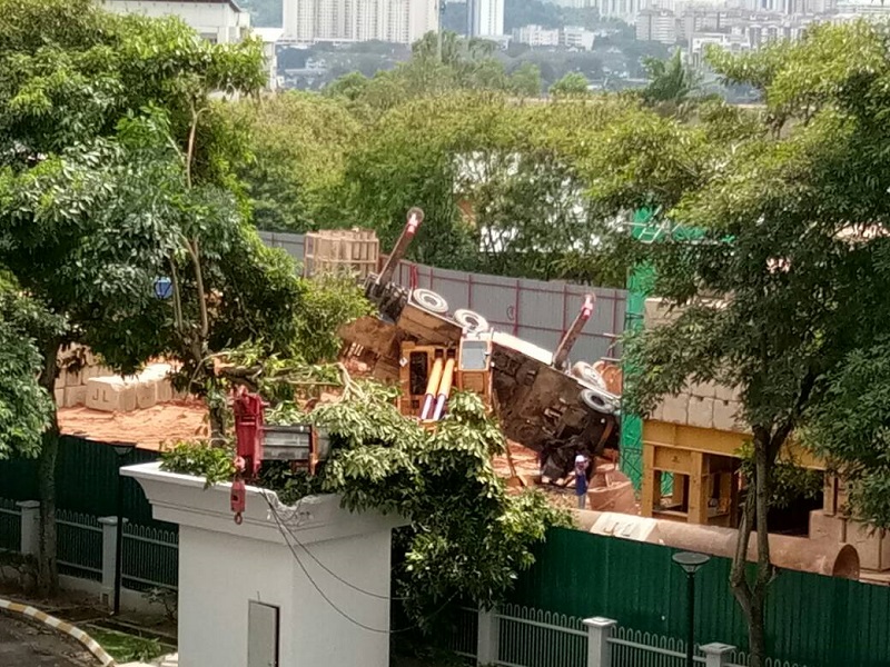 A Taman Desa resident said the crane operating at The Address project site toppled at 2.03pm, with its arm falling onto a concrete structure inside the compound of Tiara Faber. u00e2u20acu201d Picture courtesy of Save Taman Desa coalition