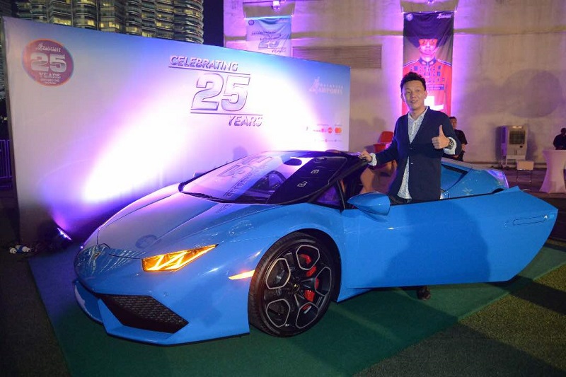Japanese businessman Riyo Kawakami poses with the Lamborghini Huracan Spyder. u00e2u20acu201d Picture courtesy of MAHB