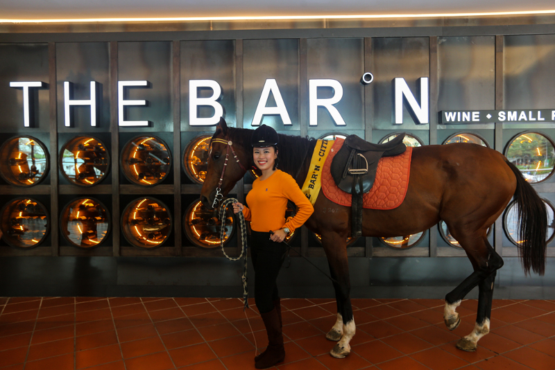 The Barn co-founder Candice Lee poses with Barnabas the mascot of The Barn in Citta Mall, January 22, 2018. u00e2u20acu201d Picture by Ahmad Zamzahuri