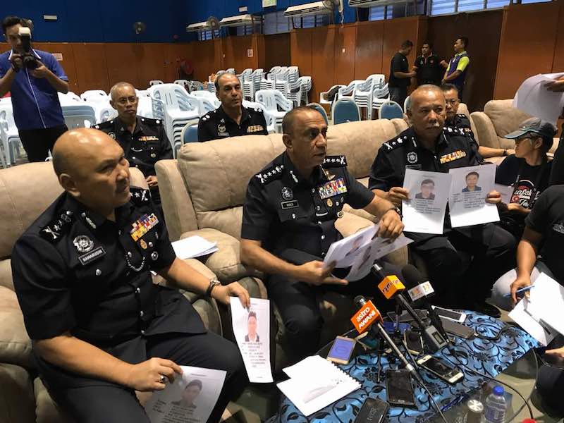 Johor police chief Datuk Mohd Khalil Kader Mohd (centre) flanked by his deputy Datuk Mohd Kamarudin Md Din and Johor criminal investigations department (CID) chief Kamaluddin Kassim. u00e2u20acu201d Picture by Ben Tan