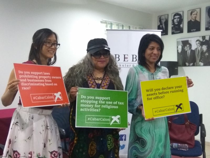 (From left) Bebas co-founder Boo Su-Lyn, lawyer Siti Kasim and C4 founder Cynthia Gabriel hold up posters of the #CabarCalon campaign at its launch in Petaling Jaya, Selangor January 27, 2018. u00e2u20acu201d Picture courtesy of Bebas