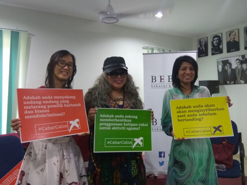 (From left) Bebas co-founder Boo Su-Lyn, lawyer Siti Kasim and C4 founder Cynthia Gabriel hold up posters of the #CabarCalon campaign at its launch in Petaling Jaya, Selangor January 27, 2018. — Picture courtesy of Bebas
