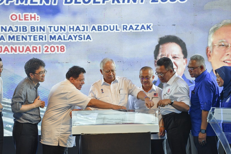 Prime Minister Datuk Seri Najib Razak looks at a replica of the Labuan Bridge during the launch of the Labuan Development Blueprint 2030 in Labuan January 18, 2018. u00e2u20acu201d Bernama pic
