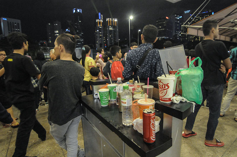 Some of the rubbish collected by the volunteers included empty cups and cans that revellers did not bother to throw into rubbish bins provided. — Picture by Miera Zulyana 