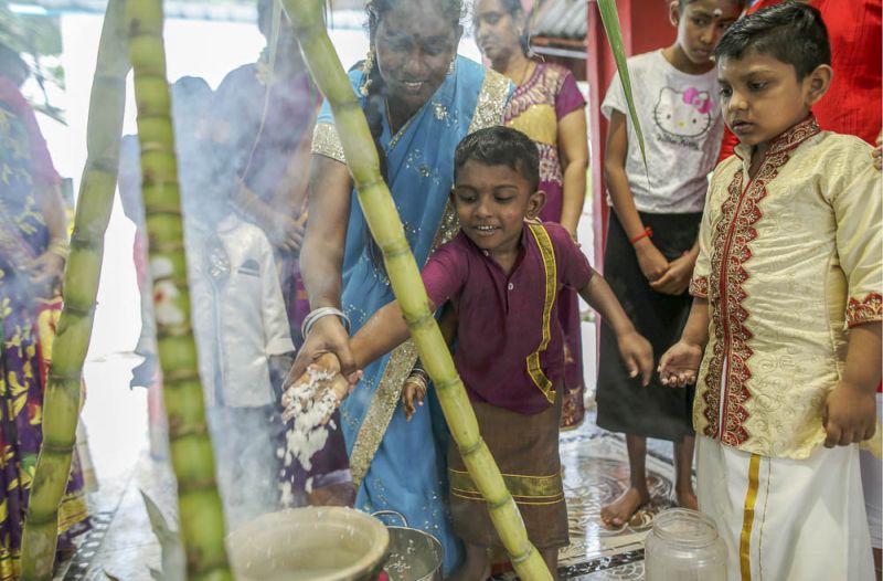 Children take part in  the Ponggal Festival at the Sri Maha Kala Muneswarar temple in Sentul January 13, 2018. u00e2u20acu201d Picture by Azneal Ishak.