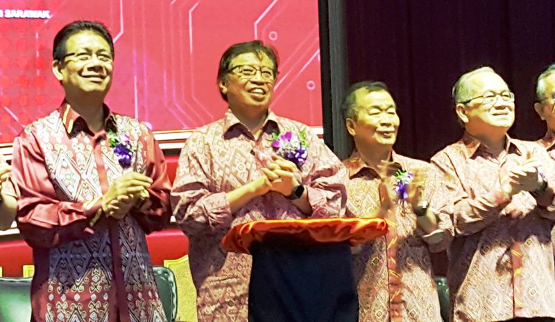 Chief Minister Datuk Patinggi Abang Johari Openg (second left) at the joint opening of six PBB branches annual general meetings, January 21, 2018. u00e2u20acu201d Picture by Sulok Tawie