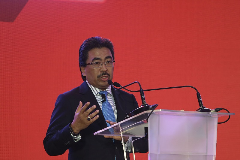 Second Finance Minister Datuk Seri Johari Abdul Ghani delivers his keynote address during CIMB 10th Annual Malaysia Corporate Day in Kuala Lumpur January 4, 2018. u00e2u20acu201d Picture by Yusof Mat Isa