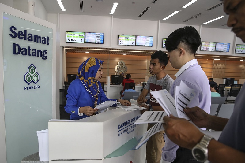 A Socso employee attends to a customer at Wisma Perkeso in Kuala Lumpur January 10, 2018. u00e2u20acu201d Picture by Yusof Mat Isa