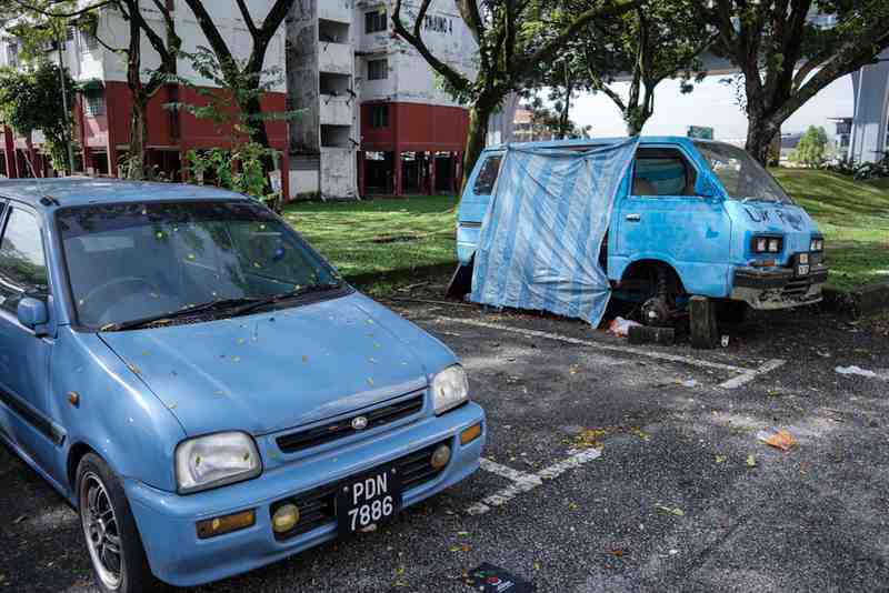 An abandoned car left near a parking area January 24, 2018. u00e2u20acu201d Picture by Ahmad Zamzahurin
