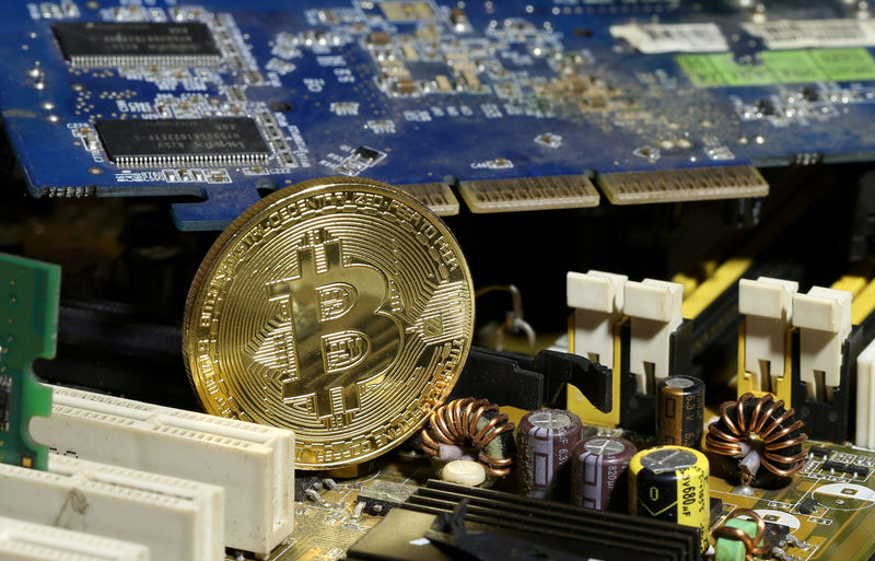 A copy of bitcoin standing on PC motherboard is seen in this illustration picture, October 26, 2017. u00e2u20acu201d Reuters pic