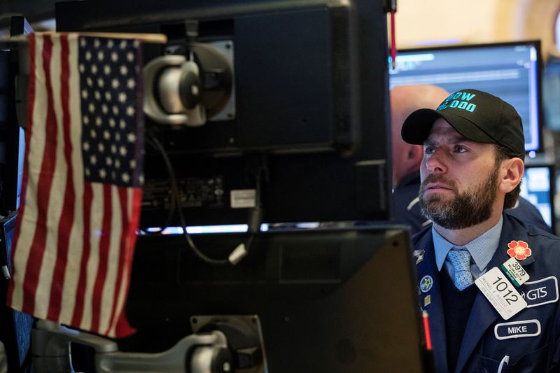 File picture shows a trader working as the Dow Jones Industrial Average rises above 25,000 on the floor of the New York Stock Exchange shortly after the opening bell in New York, January 4, 2018. u00e2u20acu201d Reuters pic