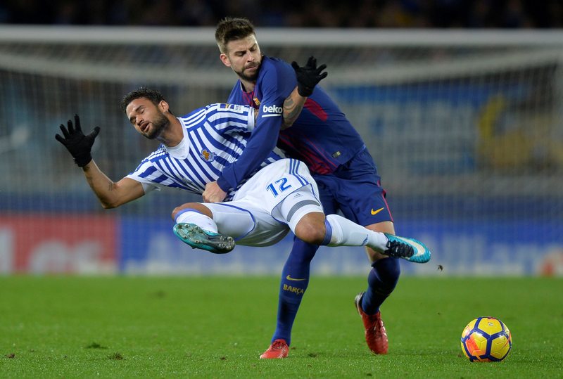 Barcelonau00e2u20acu2122s Gerard Pique (right) in action with Real Sociedad's Willian Jose in their La Liga match at San Sebastian January 14, 2018. u00e2u20acu201d Reuters pic