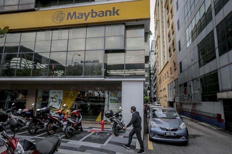 A pedestrian walks past a Maybank Bhd bank branch in Jalan Medan Tunku, Kuala Lumpur January 4, 2018. u00e2u20acu201d Picture by Firdaus Latif