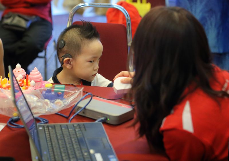 Eric could hear for the first time with a cochlear implant.