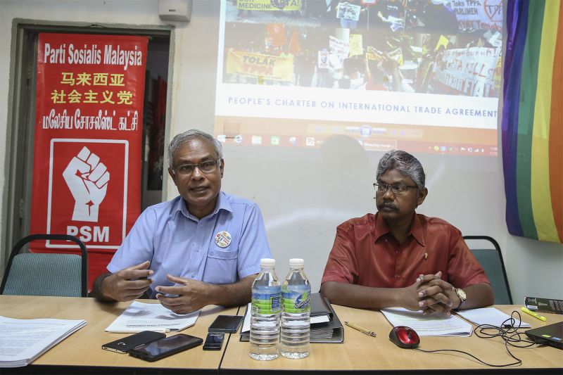 Parti Sosialis Malaysia central committee member Dr Michael Jeyakumar Devaraj (left) speaks during a press conference at the PSM headquarters in Kuala Lumpur January 17, 2018. u00e2u20acu2022 Picture by Yusof Mat Isa