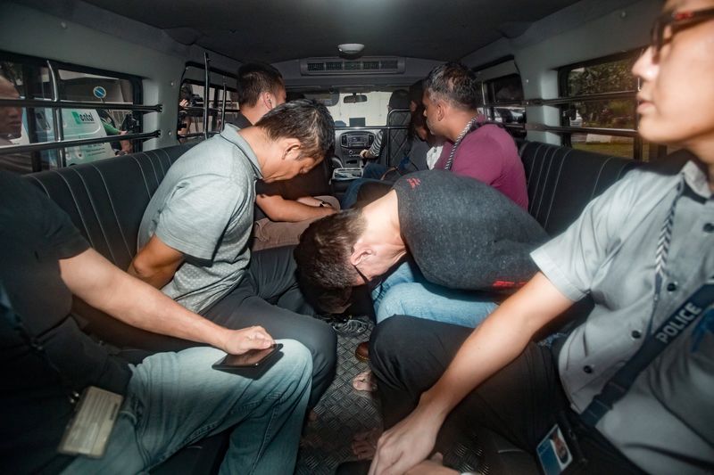 Suspects, part of a group of 17 detained over their part in an alleged oil theft at Shellu00e2u20acu2122s Pulau Bukom refinery, arrive in a van at the State Courts, Singapore January 13, 2018. u00e2u20acu201dReuters pic