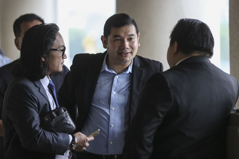 Pandan MP Mohd Rafizi Ramli (centre) with lawyer Jeffrey Ray (right) faces an amended charge for making alleged libellous statement against Tabung Haji in Kuala Lumpur January 4, 2018. u00e2u20acu201d Picture by Azneal Ishak