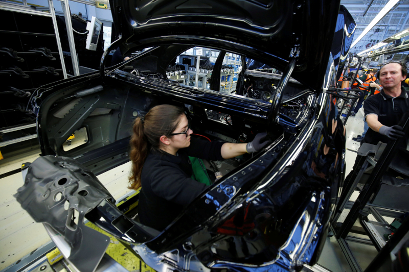 An employee of German car manufacturer Mercedes Benz works on a Mercedes S-Class (S-Klasse) car at a production line at the Mercedes Benz factory in Sindelfingen January 24, 2018. u00e2u20acu201d Reuters picn