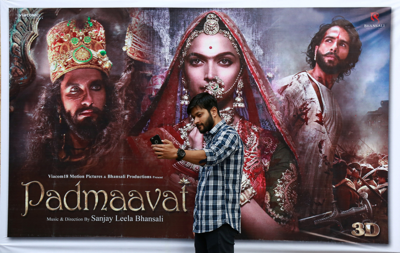 A cinemagoer takes a selfie in front of a poster of Bollywood movie u00e2u20acu02dcPadmaavatu00e2u20acu2122 outside a movie theatre in Kochi January 25, 2018. u00e2u20acu201d Reuters pic