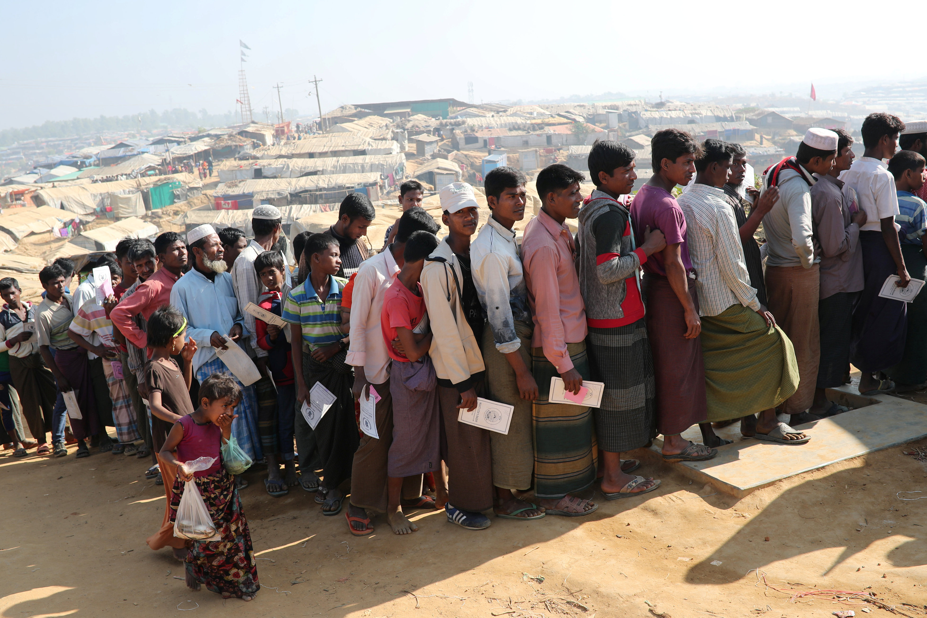 Rohingya refugees stand in a queue to collect aid supplies in Kutupalong refugee camp in Cox's Bazar, Bangladesh, January 21, 2018. u00e2u20acu201d Reuters pic 