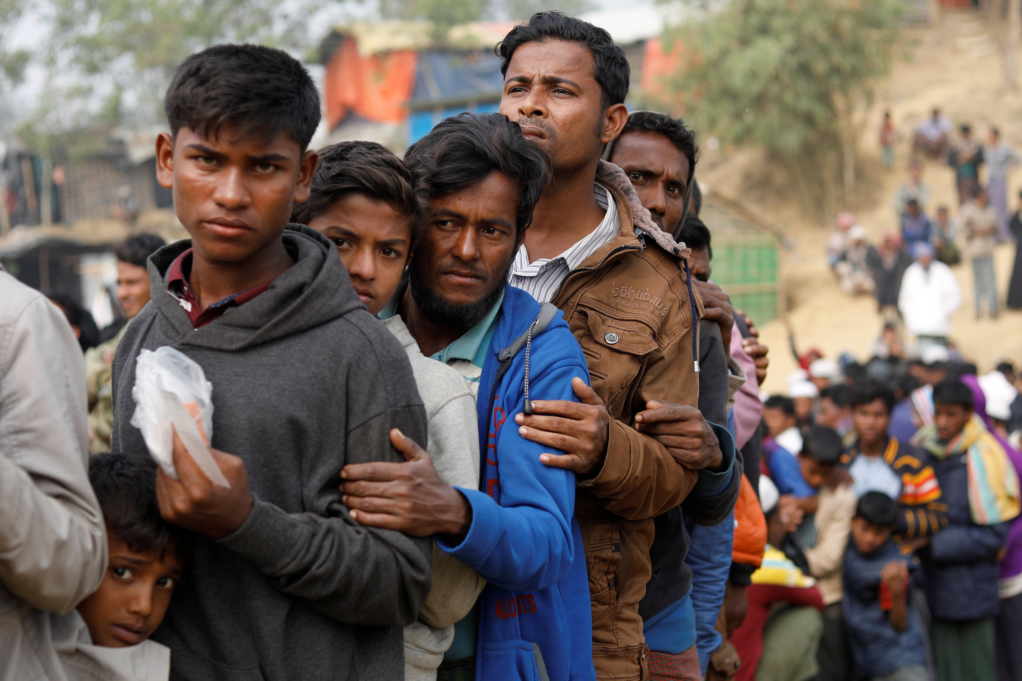 Rohingya refugees line up for daily essentials distribution at Balukhali camp, near Cox's Bazar, Bangladesh January 15, 2018. 