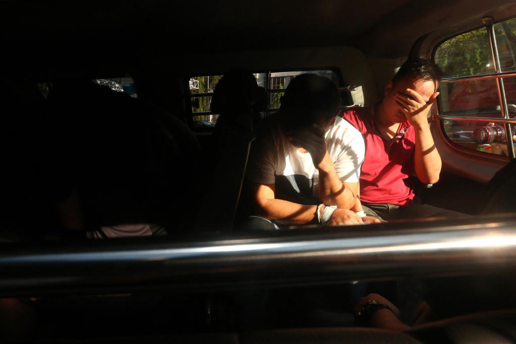 Some of the 17 men arrested for suspected involvement in misappropriating fuel from Shell Bukom are seen arriving at the State Courts on Jan 9, 2017. u00e2u20acu201d Picture by Nuria Ling/TODAY