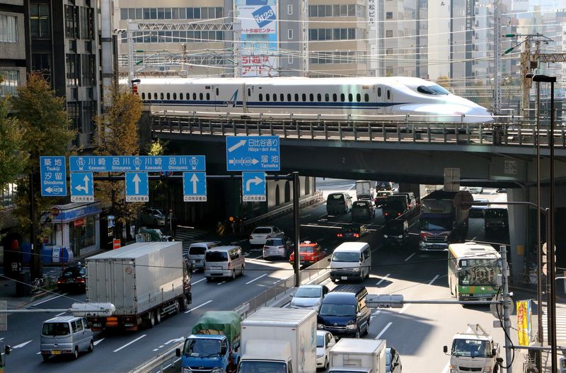File picture shows a Shinkansen bullet train passing over a road in Tokyo on December 8, 2014. u00e2u20acu2022 AFP Relaxnews pic