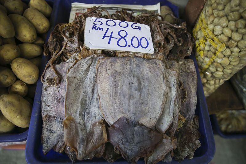 Dried cuttlefish is displayed for sale at a wet market in Kuala Lumpur on January 5, 2018. 