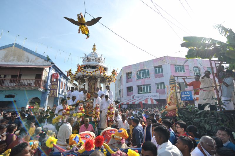 Devotees watch as the Silver Chariot passes by a temple on the eve of Thaipusam in George Town January 30, 2018. u00e2u20acu2022 Picture by KE Ooi