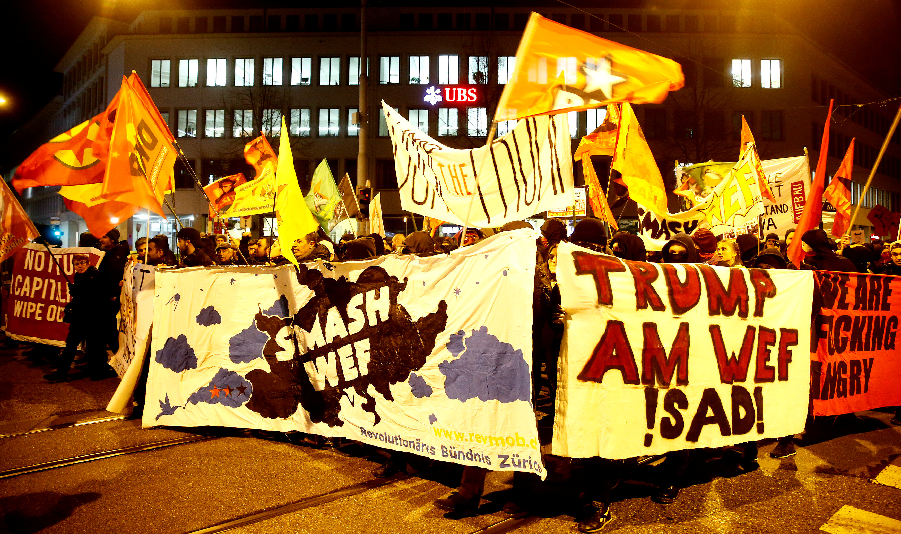Protesters carry banners during a demonstration against US President Donald Trump, ahead of Trump's visit to the World Economic Forum, in Zurich, Switzerland, January 23, 2018. u00e2u20acu201d Reuters pic
