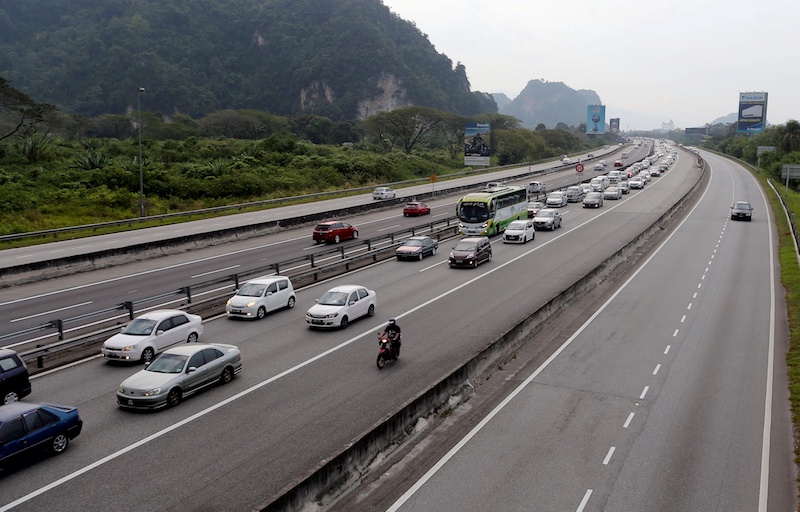 Traffic moves slowly on the North-South Expressway heading north near the Ipoh toll exit following the end of the long Chinese New Year break, February 18, 2018. u00e2u20acu201d Picture by Farhan Najib