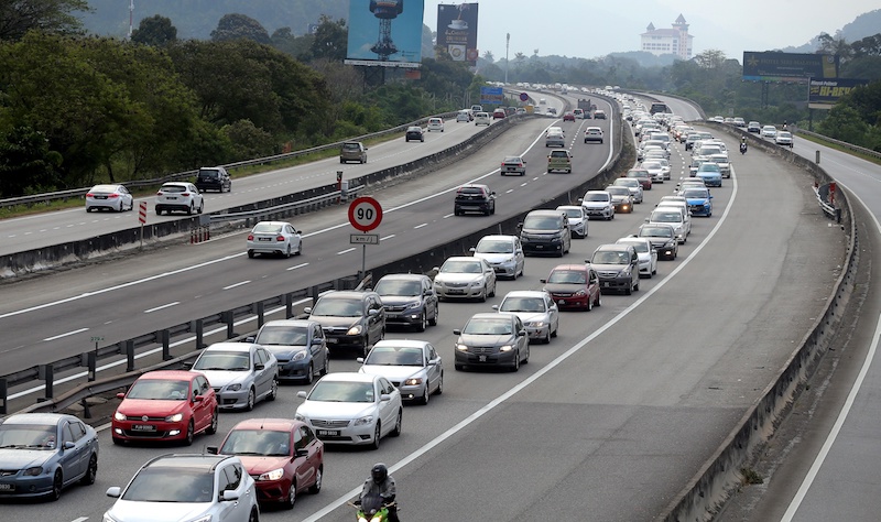 Traffic moves slowly on the North-South Expressway heading north near the Ipoh toll exit following the end of the long Chinese New Year break, February 18, 2018. u00e2u20acu201d Picture by Farhan Najib