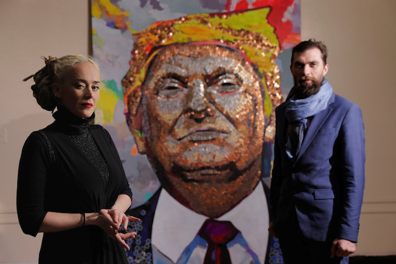 Artists Daria Marchenko and Daniel D. Green pose in front of their portrait of US President Donald Trump made of coins and casino tokens in a classroom in New York January 31, 2018. u00e2u20acu201d Reuters pic