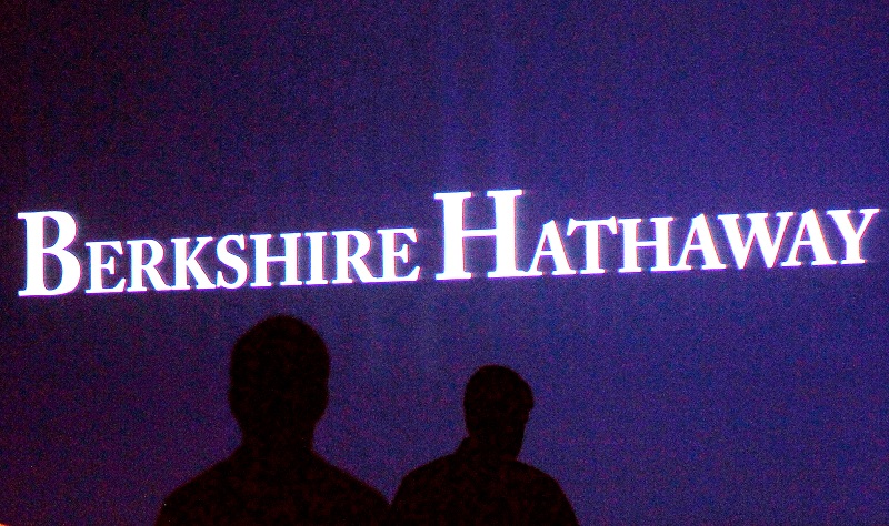 Berkshire Hathaway shareholders walk by a video screen at the companyu00e2u20acu2122s annual meeting in Omaha, Nebraska, US, May 4, 2013.u00e2u20acu201dReuters pic 