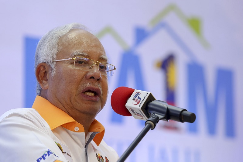 Prime Minister Datuk Seri Najib Razak (seated left) speaks during an event to hand over house keys to civil servants for the Bukit Jalil PPA1M project in Kuala Lumpur February 6, 2018. u00e2u20acu201d Picture by Yusof Mat Isa