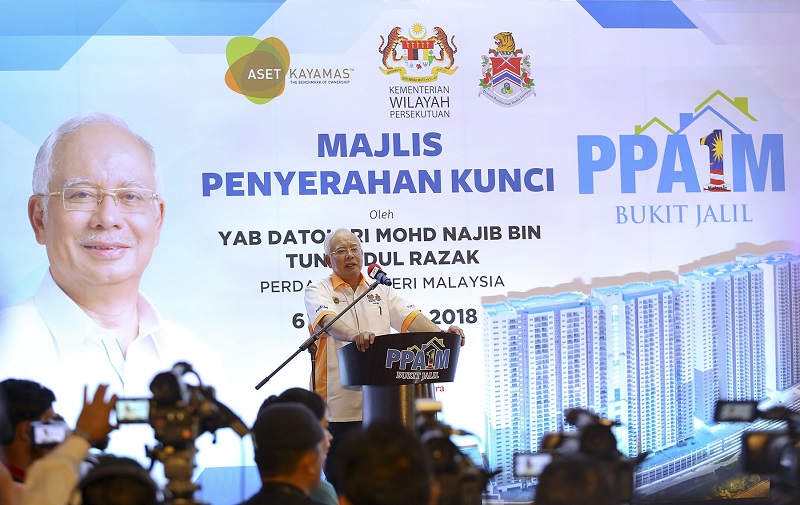 Prime Minister Datuk Seri Najib Razak (seated left) speaks during an event to hand over house keys to civil servants for the Bukit Jalil PPA1M project in Kuala Lumpur February 6, 2018. u00e2u20acu201d Picture by Yusof Mat Isa