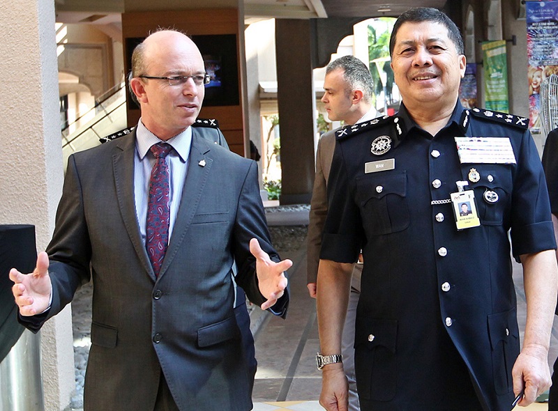 Interpol Counter Terrorism Directorate specialised officer Dennis Adriao (left) and Bukit Aman Criminal Investigations Department Director Commissioner Datuk Seri Wan Ahmad Najmuddin Mohd at the Project Vector Bioterrorism Evidence Workshop in Putrajaya F