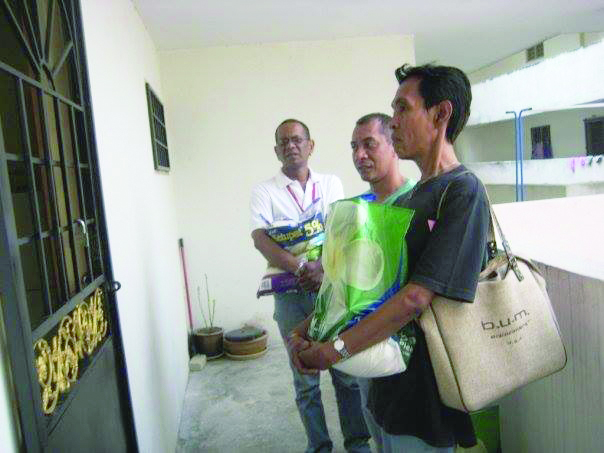 Monteiro (left) and friends delivering food aid. u00e2u20acu201d Picture courtesy of PT Foundation