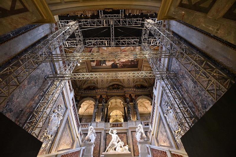 A picture showing scaffolders under a suspended bridge, twelve metres above ground, allowing visitors to take a closer look to paintings by Austrian painter Gustav Klimt which adorn the arches of the mains staircase at the Kunsthistorisches Museum in Vien