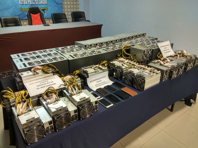 The stolen Bitcoin mining machines and power supply unit recovered by police after they were sold online by the suspects. u00e2u20acu201d Picture by Kenneth Tee