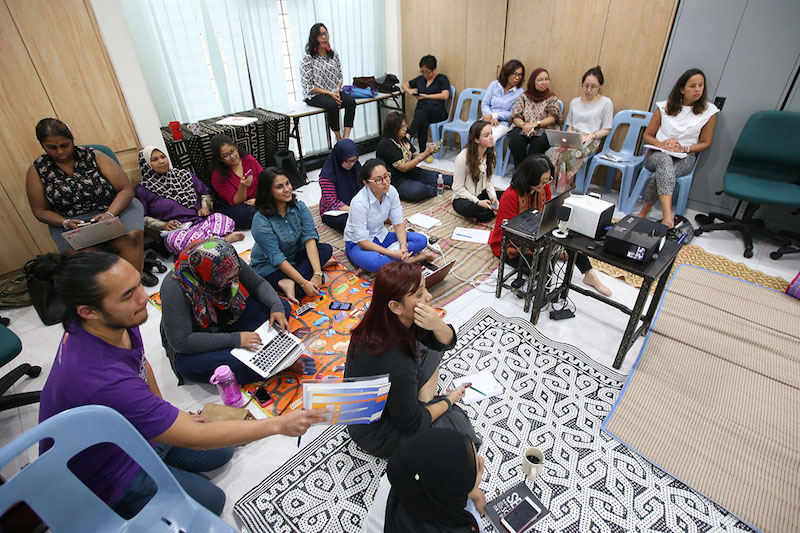 Activists and NGO reps watch Malaysia's presentation in Geneva on its achievements as a signatory to the UN Convention on the Elimination of All Forms of Discrimination Against Women, in Petaling Jaya February 20, 2018. u00e2u20acu201d Picture by Azinuddin Ghazali