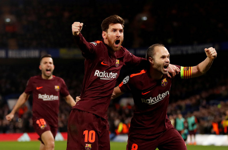 Barcelonau00e2u20acu2122s Lionel Messi celebrates scoring their first goal with Andres Iniesta at Stamford Bridge in London February 20, 2018. u00e2u20acu201d Action Images handout via Reuters