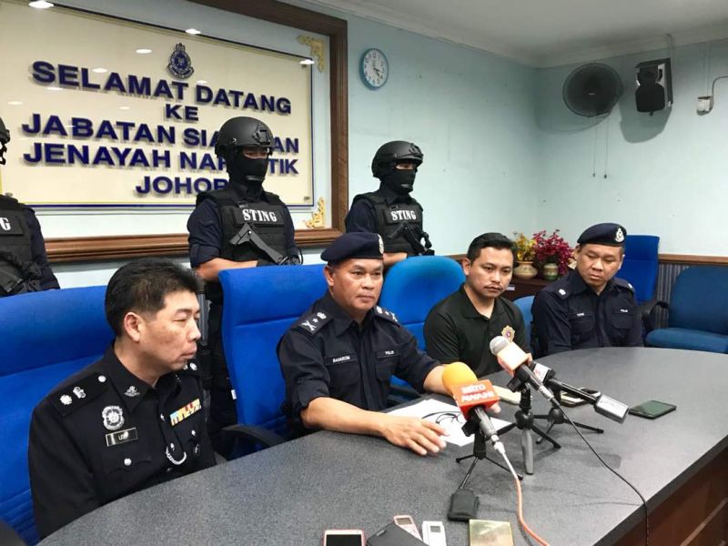 Baharom (second from left) said the current trend for addicts and street pushers was to gather in smaller groups for short periods to avoid detection. u00e2u20acu201d Picture by Ben Tan