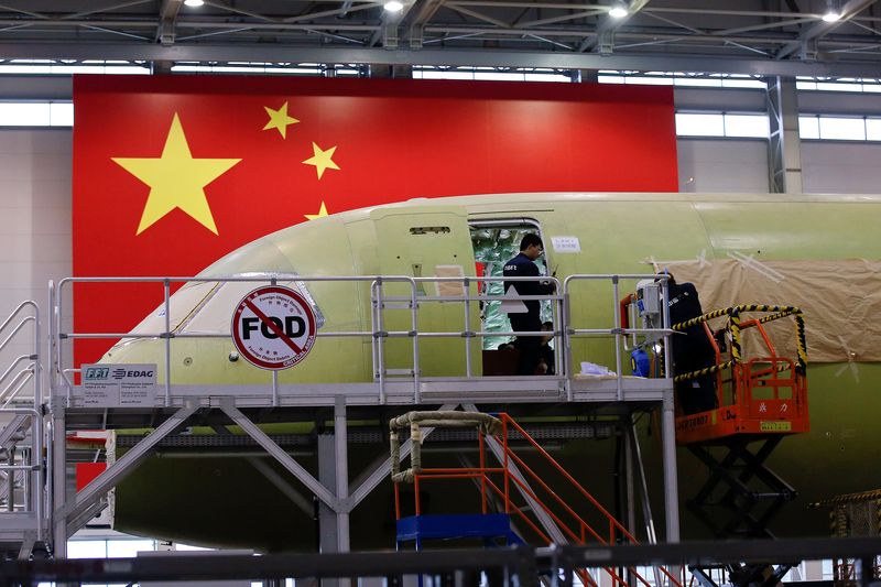 Employees work on a Chinau00e2u20acu2122s home-grown C919 passenger jet at Manufacturing and Final Assembly Center of state-owned Commercial Aircraft Corporation of China (COMAC) during a media tour in Shanghai, May 4, 2017. u00e2u20acu201d Reuters pic