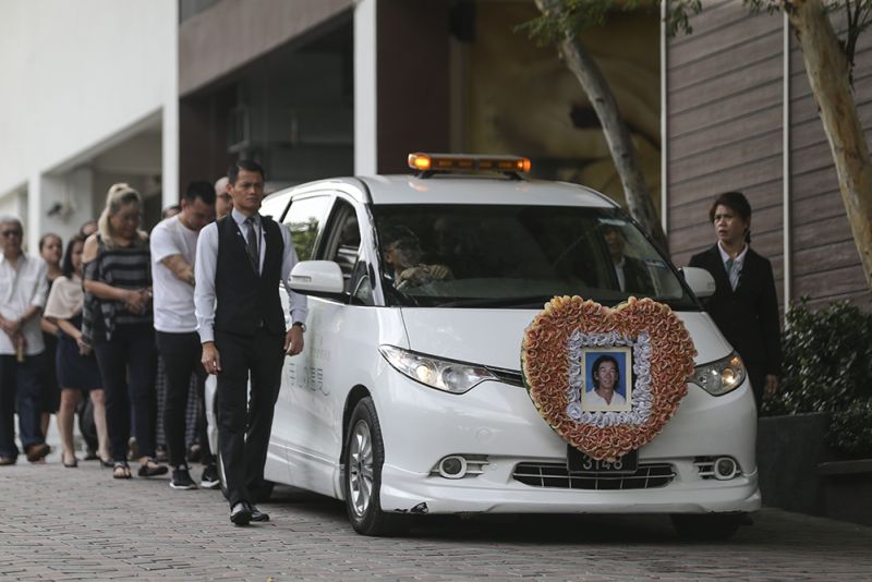 Friends and family members walk behind Chow Chee Keong's hearse as the funeral cortege departed for Shah Alam, February 24, 2018. u00e2u20acu2022 Picture by Azneal Ishak